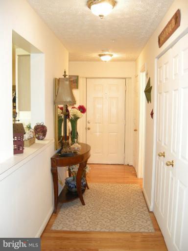 576 Kennington Road, Unit 576 Reisterstown, MD 21136 - Photo 2 of 18 Warm and Inviting Foyer w/Hardwood Floors