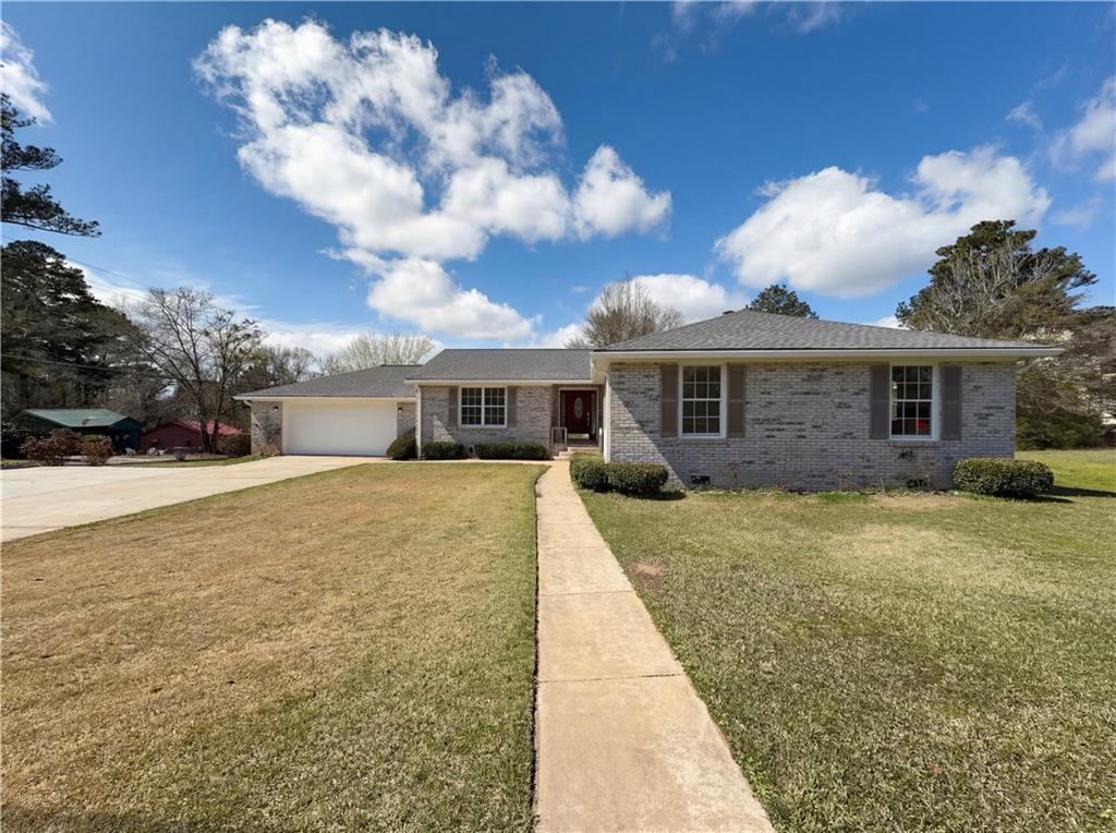 428 Macon Street LaGrange, GA 30241 - Photo 1 of 1 a front view of a house with a yard and garage
