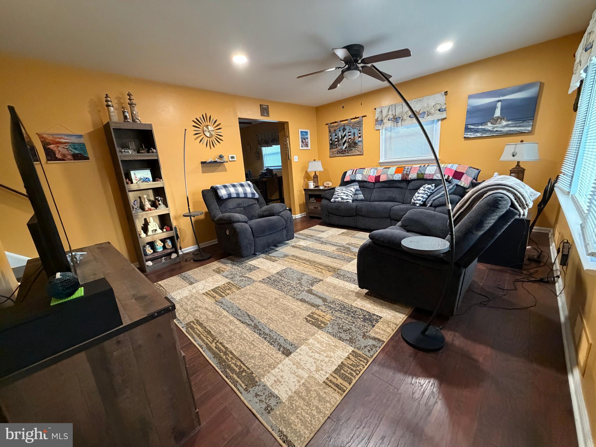 1 Nassau Road Somers Point, NJ 08244 - Photo 4 of 43 a living room with furniture a flat screen tv and a window
