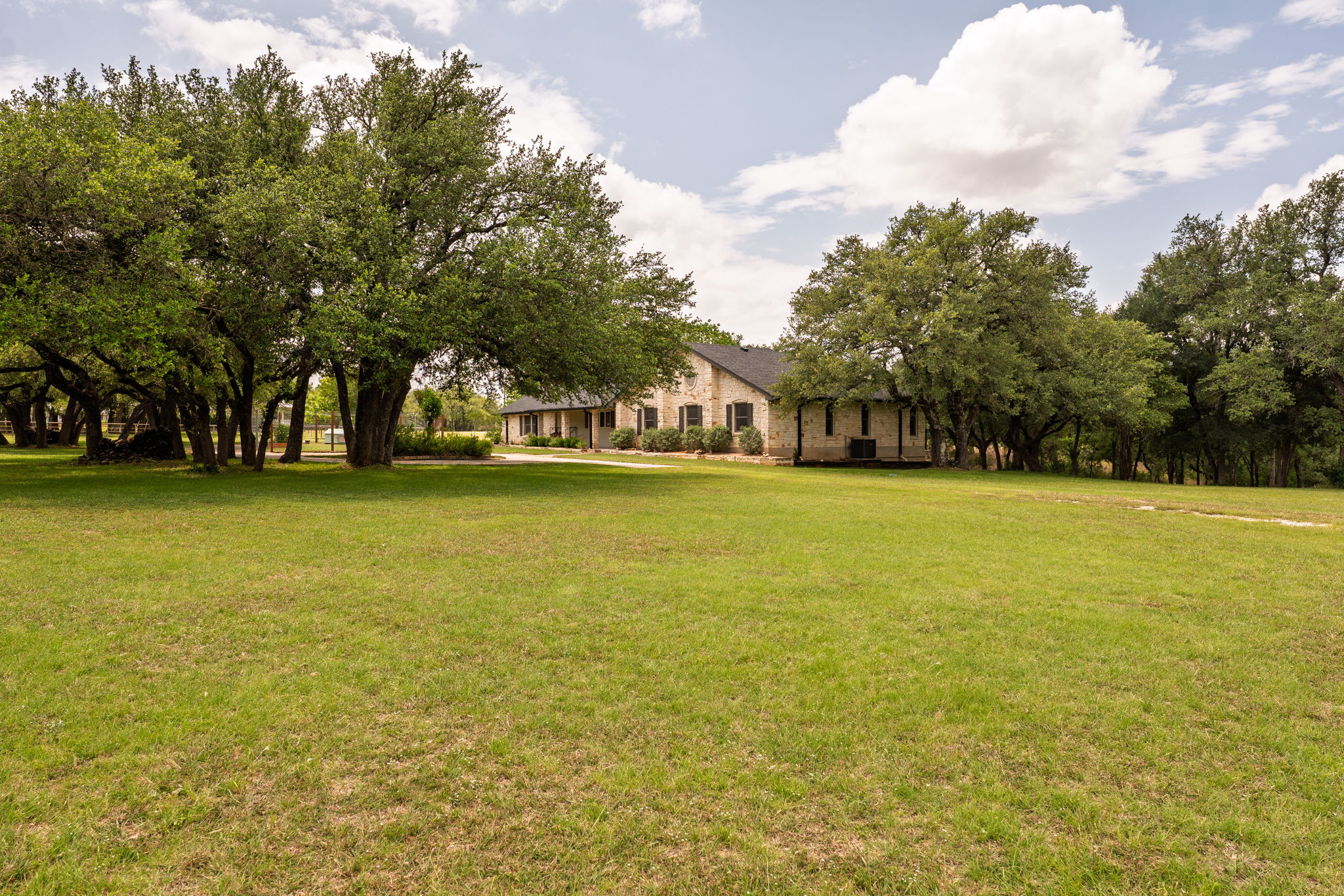 320 Greenridge Road Georgetown, TX 78628 - Photo 3 of 38 a view of a swimming pool and trees in the background