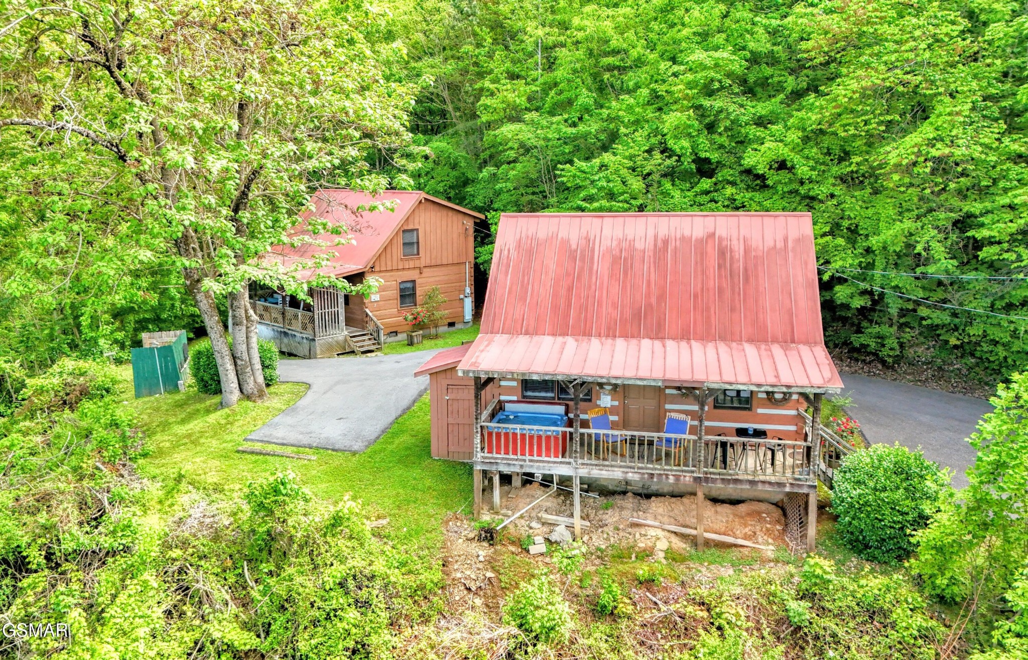 2570 Pittman Center Road Sevierville, TN 37876 - Photo 55 of 61 an aerial view of a house with swimming pool and garden