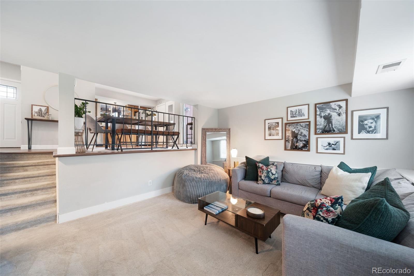 17372 East Prentice Circle Centennial, CO 80015 - Photo 16 of 41 a living room with furniture and a book shelf
