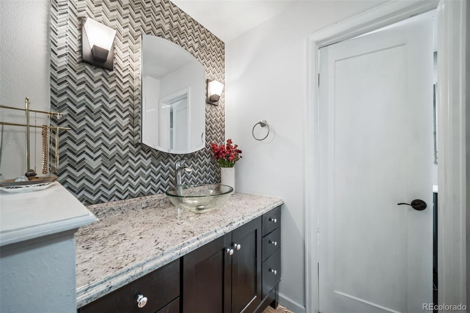 17372 East Prentice Circle Centennial, CO 80015 - Photo 19 of 41 a bathroom with a granite countertop sink and a mirror