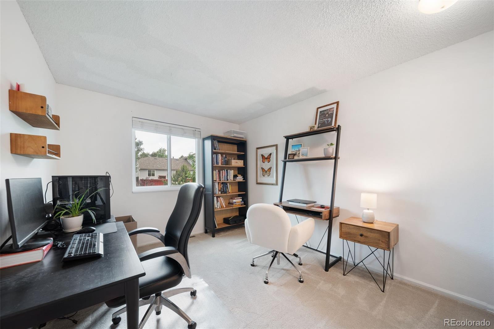 17372 East Prentice Circle Centennial, CO 80015 - Photo 20 of 41 a view of a workspace with furniture and a window