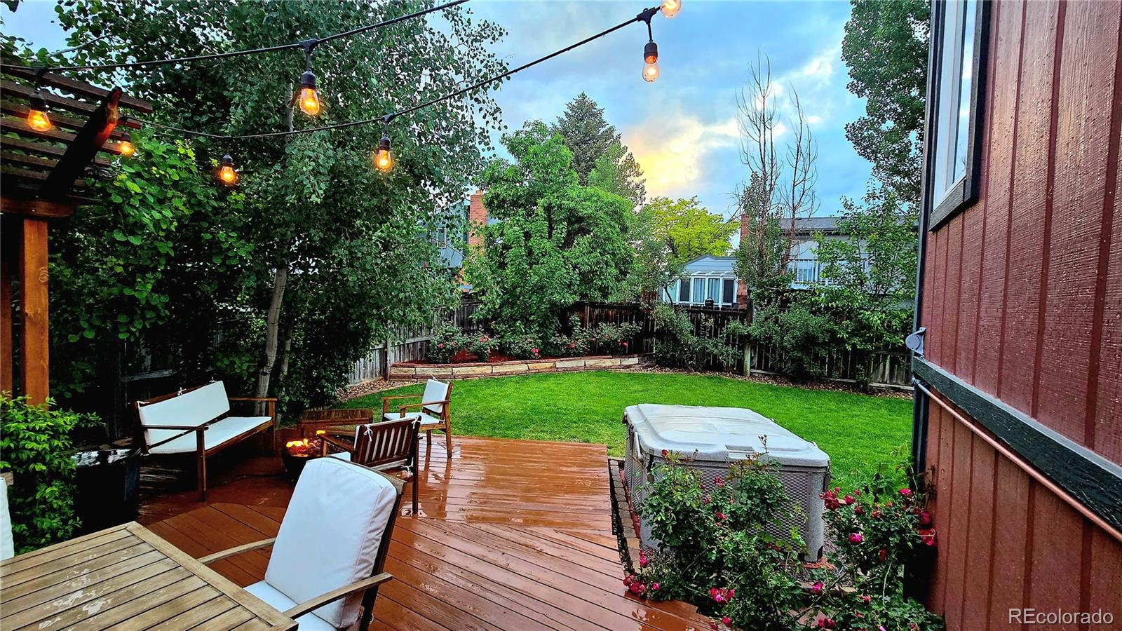 17372 East Prentice Circle Centennial, CO 80015 - Photo 24 of 41 a view of a chairs and table in backyard of the house