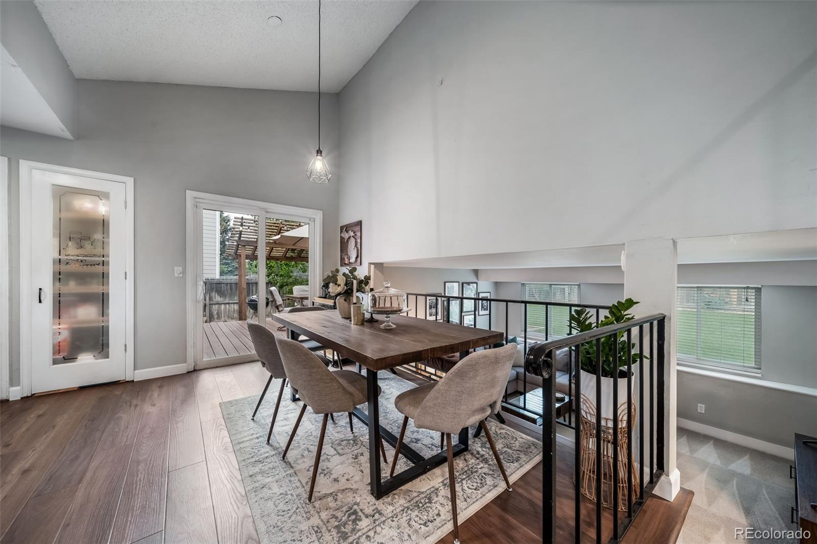 17372 East Prentice Circle Centennial, CO 80015 - Photo 8 of 41 a view of a dining room with furniture and wooden floor