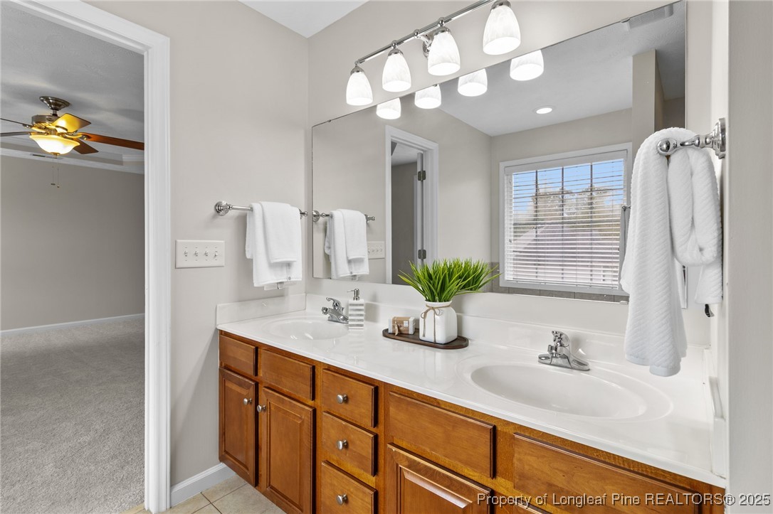 43 Ambrose Point Cameron, NC 28326 - Photo 31 of 45 a bathroom with a double vanity sink and a mirror