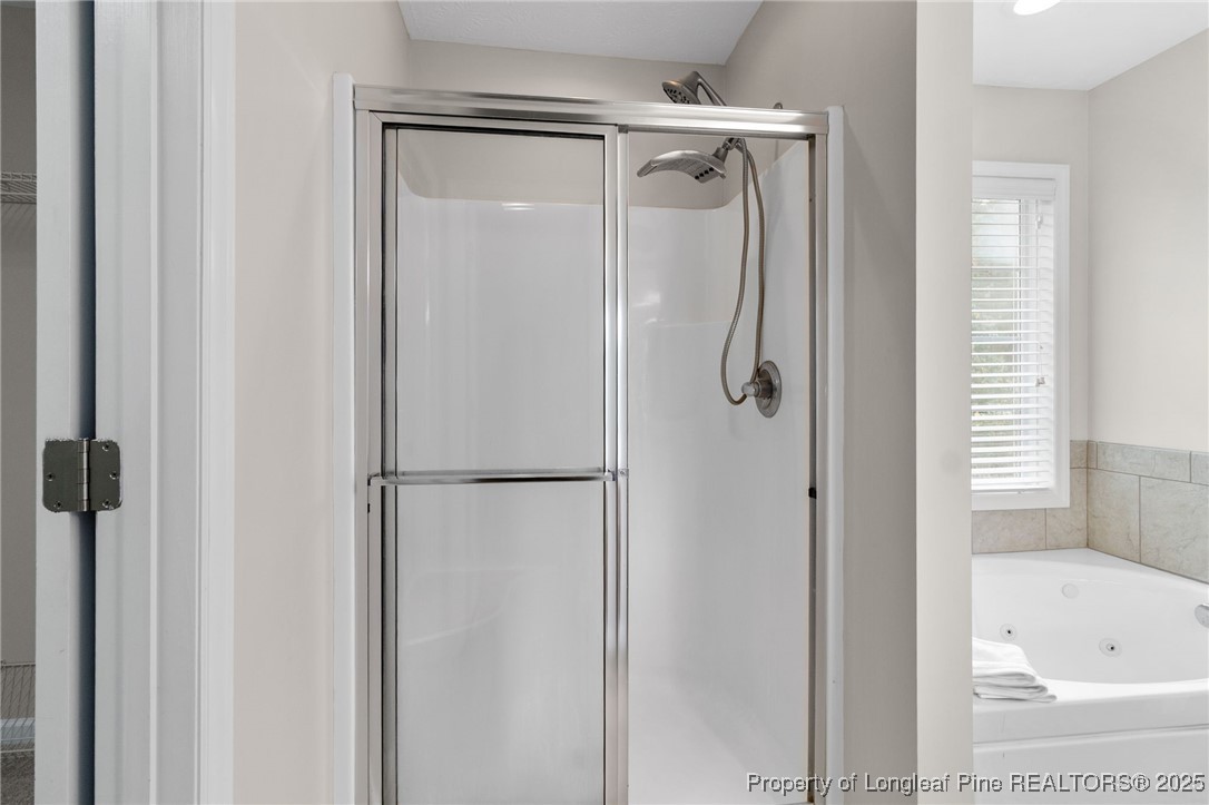 43 Ambrose Point Cameron, NC 28326 - Photo 33 of 45 a bathroom with a shower and a tub