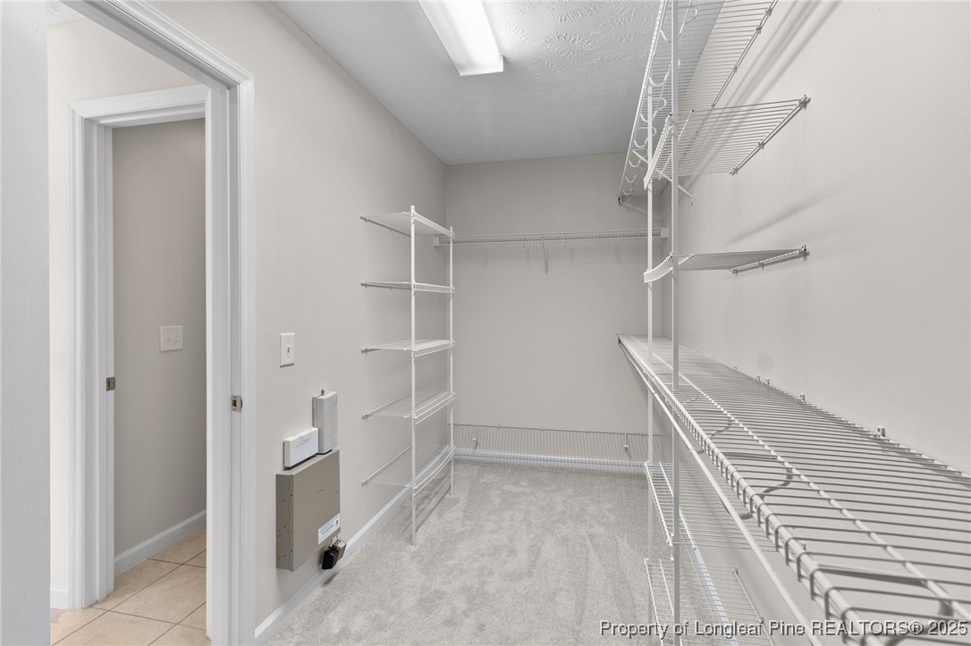 43 Ambrose Point Cameron, NC 28326 - Photo 34 of 45 a view of walk in closet with empty racks