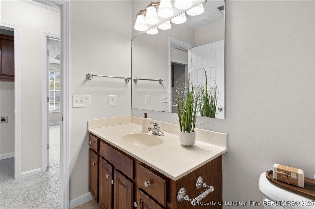 43 Ambrose Point Cameron, NC 28326 - Photo 38 of 45 a bathroom with a sink a vanity and a mirror