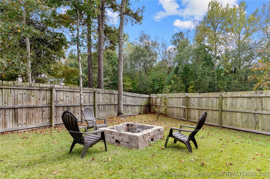 43 Ambrose Point Cameron, NC 28326 - Photo 42 of 45 a view of a chairs and table in the back yard of the house