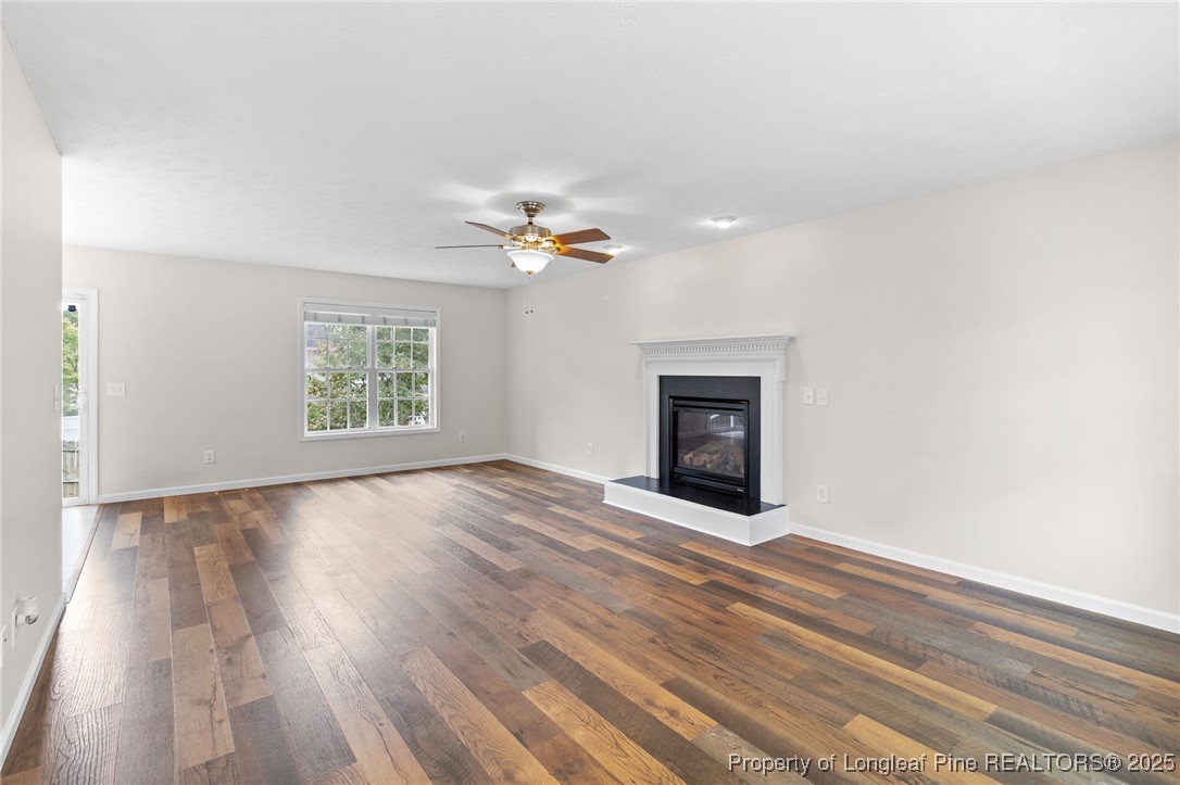 43 Ambrose Point Cameron, NC 28326 - Photo 7 of 45 an empty room with windows and fireplace