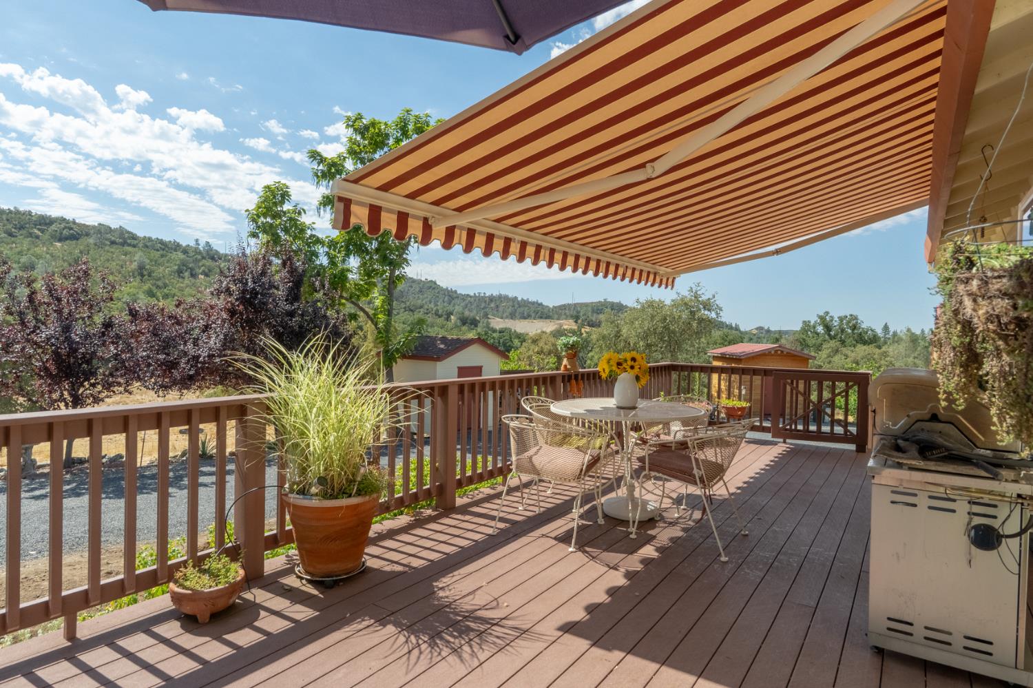 a view of balcony with furniture and wooden floor