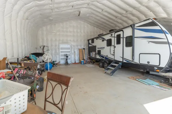 a room with gym equipment and mirror