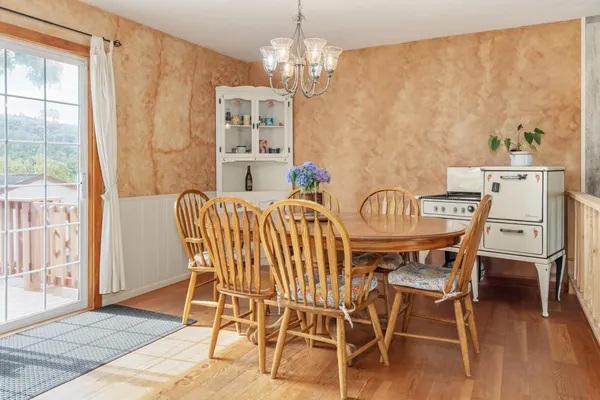 a view of a dining room with furniture window and outside view