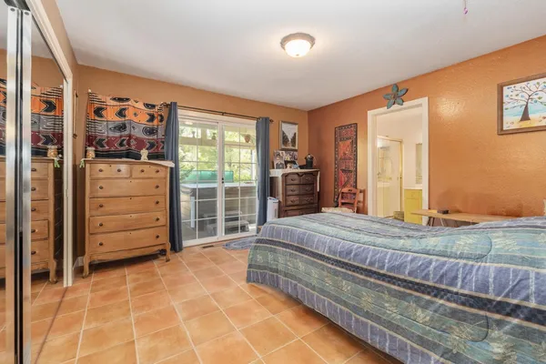 a bedroom with a bed and a cabinets