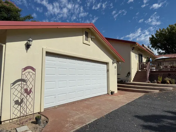 a front view of a house with garage