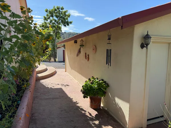 a vase of flowers sitting on a floor