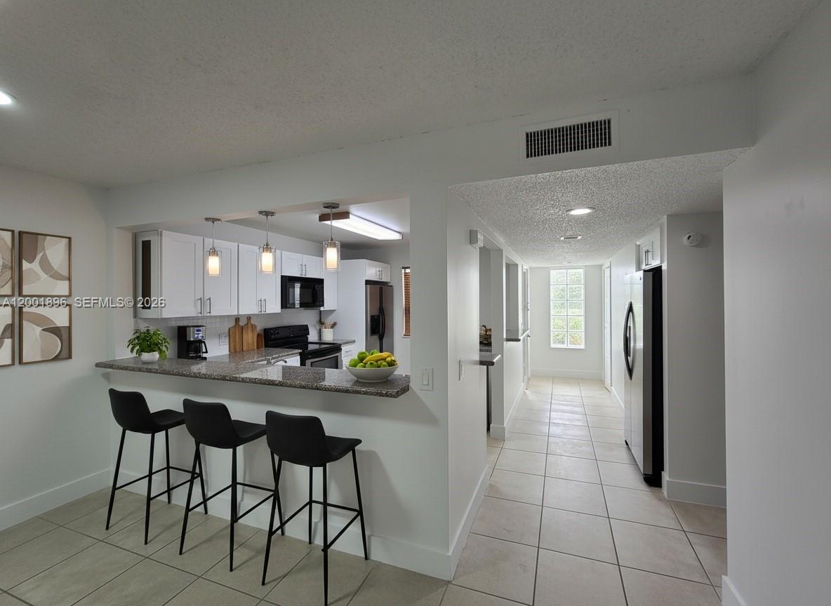 310 Racquet Club Road, Unit 204 Weston, FL 33326 - Photo 1 of 34 AI Staging