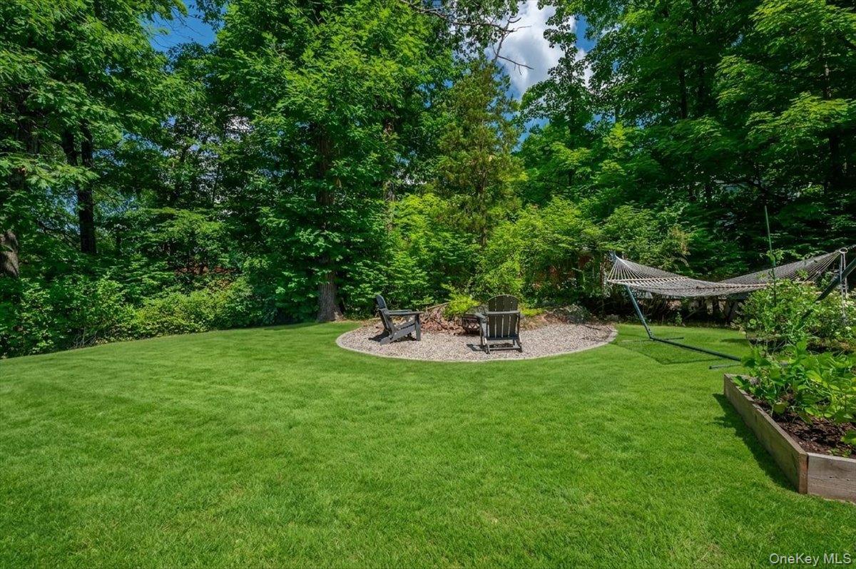 105 High St Extension Mount Kisco, NY 10549 - Photo 9 of 38 a view of a house with a backyard porch and sitting area