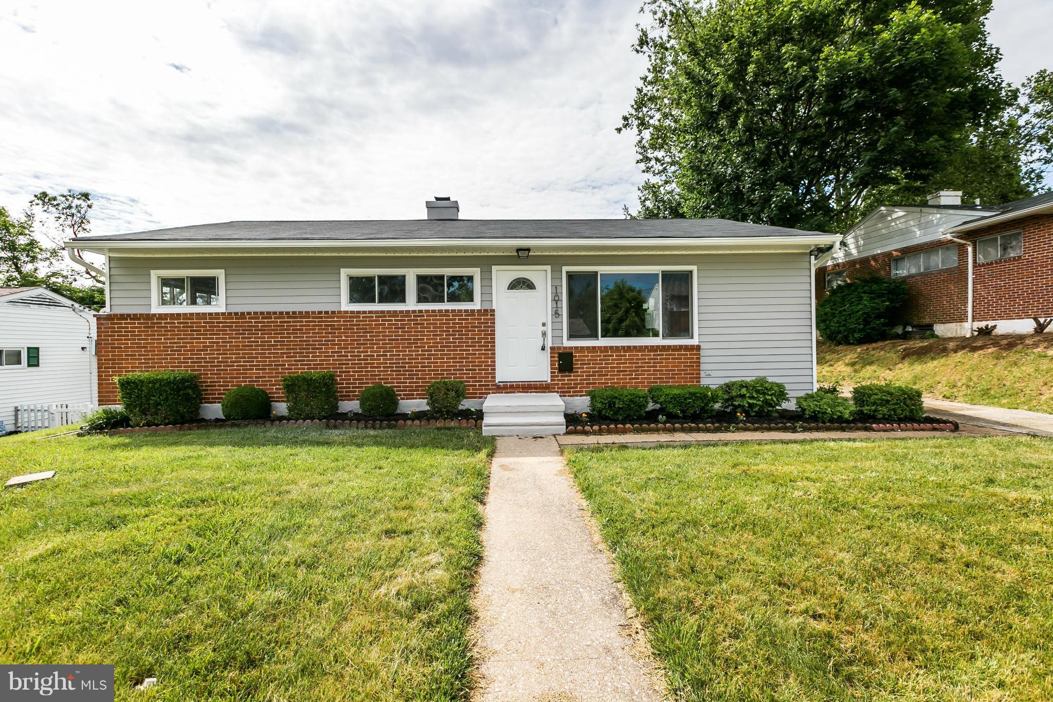 1015 Marksworth Road Catonsville, MD 21228 - Photo 1 of 13 front view of a house with a yard