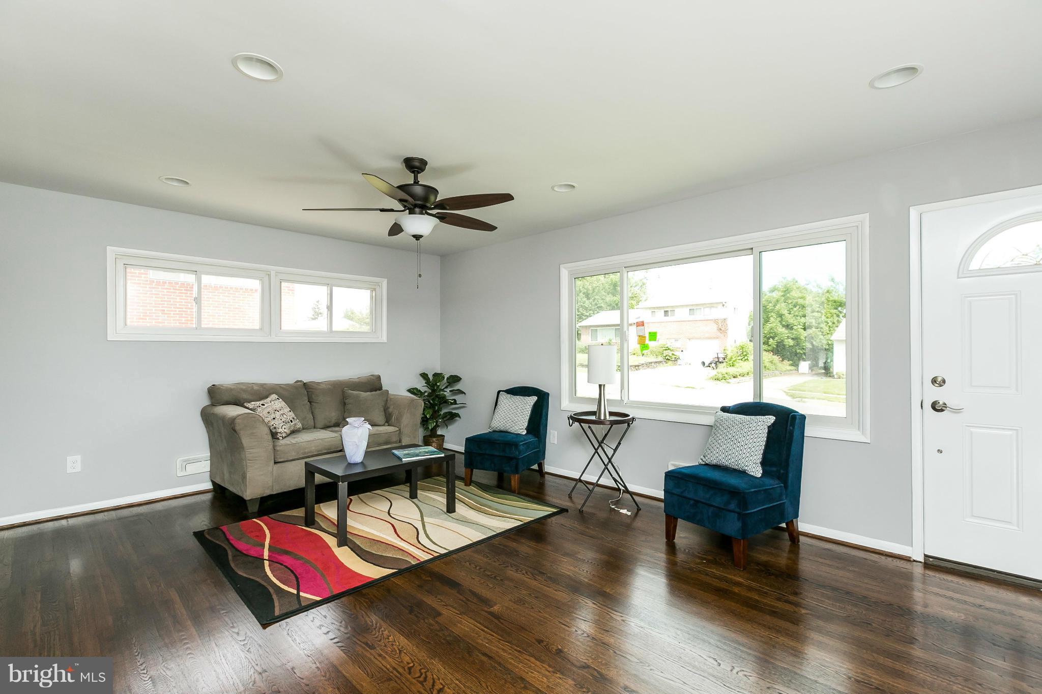 1015 Marksworth Road Catonsville, MD 21228 - Photo 2 of 13 a living room with furniture and wooden floor