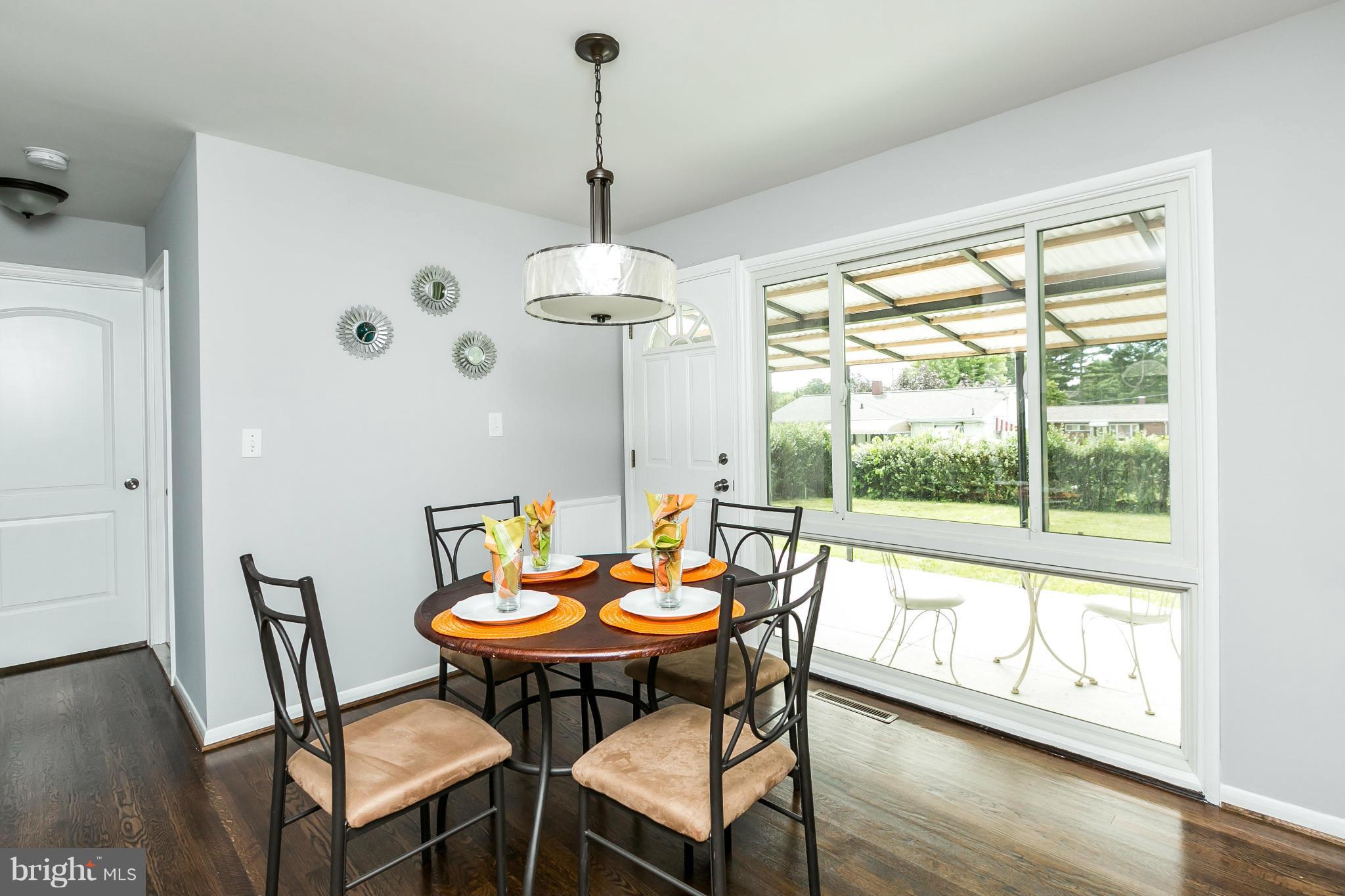 1015 Marksworth Road Catonsville, MD 21228 - Photo 3 of 13 a view of a dining room with furniture window and wooden floor