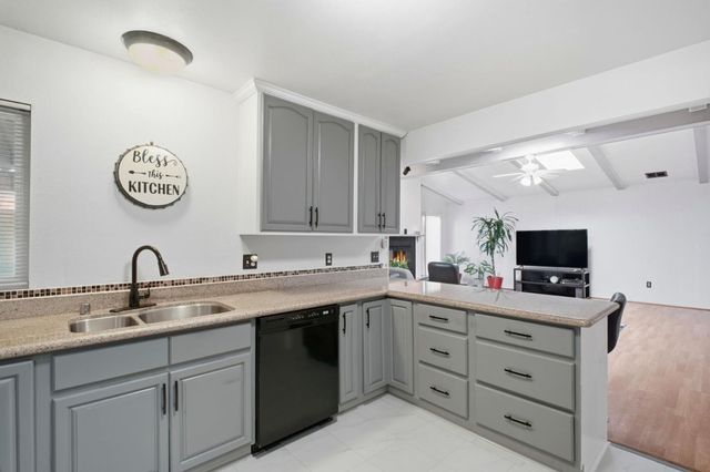 a kitchen with a sink and cabinets