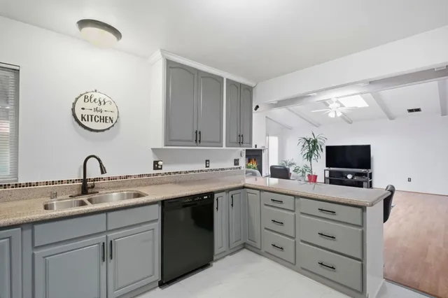 a kitchen with a sink and cabinets