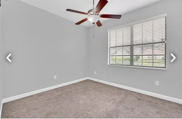 a bathroom with a granite countertop sink a toilet and a bathtub