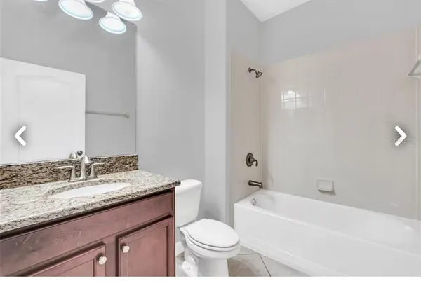 a view of swimming pool with a yard