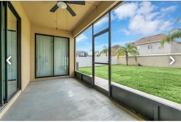 a view of yard with swimming pool and green space