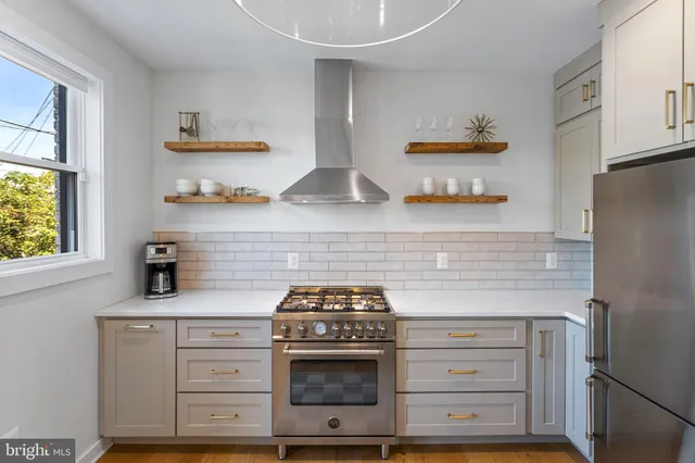 a kitchen with sink and window