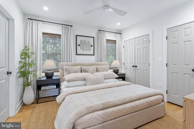 a bedroom with a bed and a couch