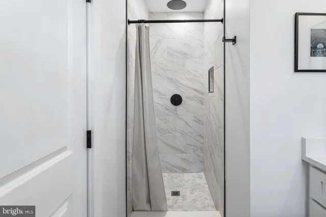 a view of a bedroom with washer and dryer