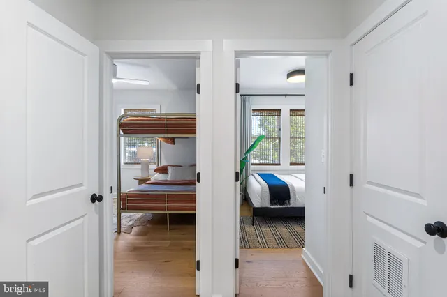 a bathroom with a sink mirror vanity and toilet