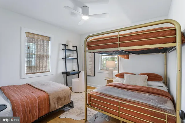 a living room with furniture a couch and a flat screen tv