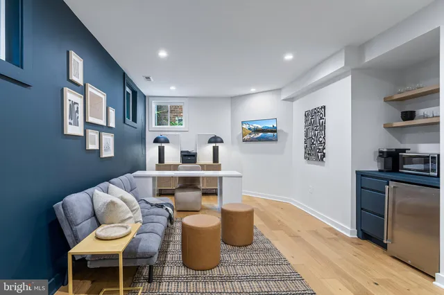 a living room with furniture and a table