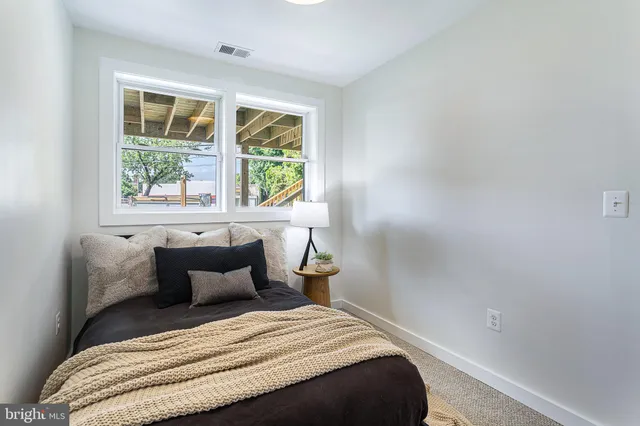a view of a workspace with furniture and a potted plant