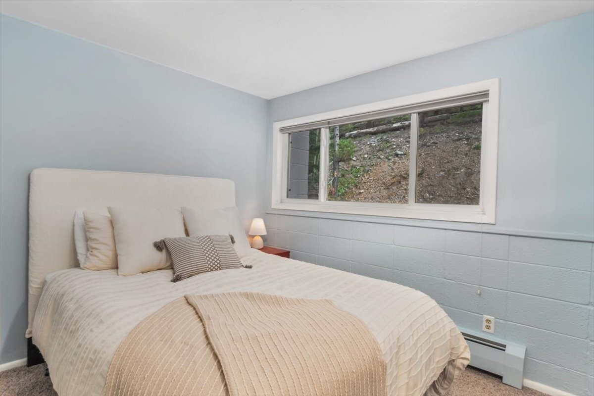 304 South High Street, Unit 3S Breckenridge, CO 80424 - Photo 7 of 20 a bedroom with a bed and a window