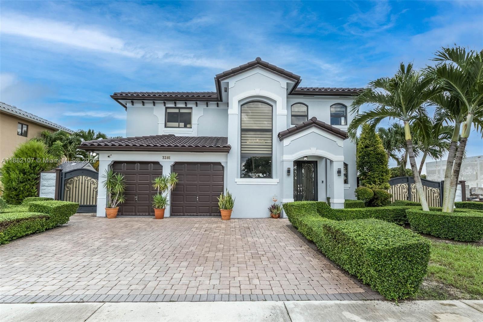 a front view of a house with a garden