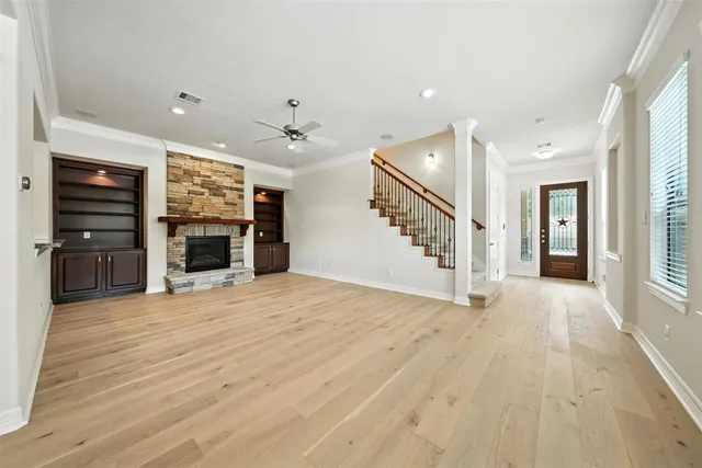 an empty room with furniture and a fireplace