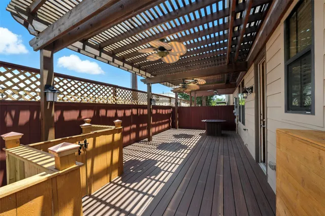 a view of outdoor space with wooden floor