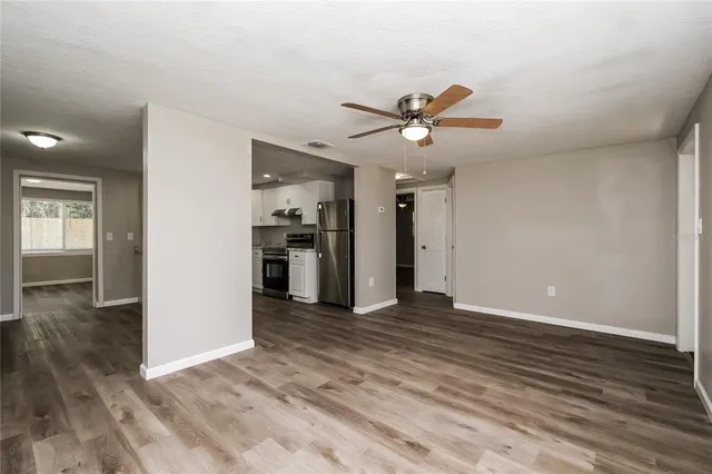 a view of a kitchen with a sink and a kitchen counter space
