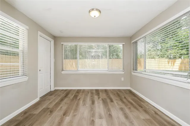 a view of an empty room with a window