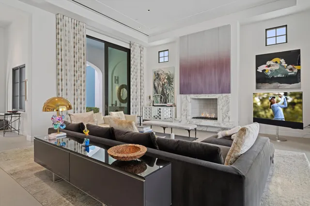a bathroom with a granite countertop sink a mirror and a shower