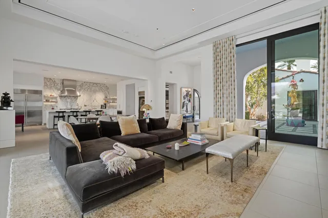 a bedroom with a bed and a clock on the wall