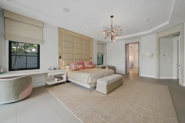 a view of a chairs and table in patio with a lake view