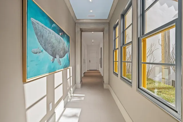 a front view of a house with swimming pool garden and patio