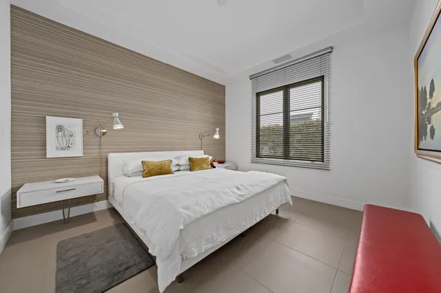 a outdoor sitting area with couch and a fire pit